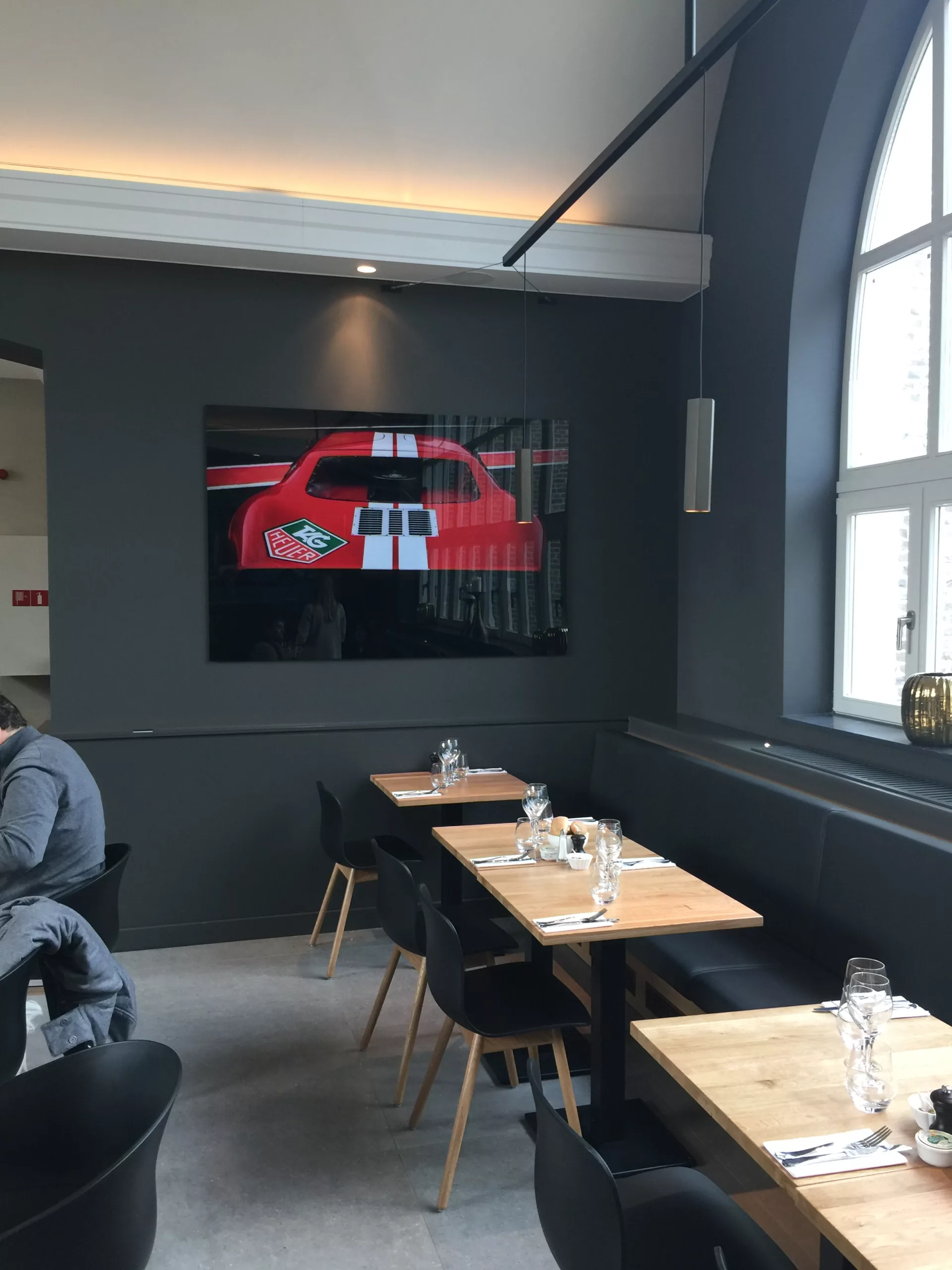 Industrial car showroom with framed fine art print and red car — Cars and Roses