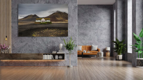 Framed photography of Iceland's Lonely Diner displayed in a modern interior above a sofa