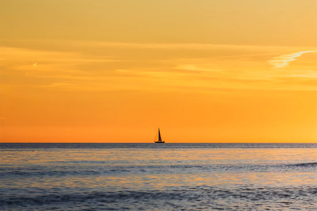 Fine art photograph minimalist sunset Marbella lone sailboat Mediterranean sea Costa del Sol limited edition orange landscape print