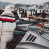 Ferrari 275 GTB photography showing a person in white winter attire with ski gear mounted on a classic silver Ferrari at the St. Moritz Concours d'Elegance 2023