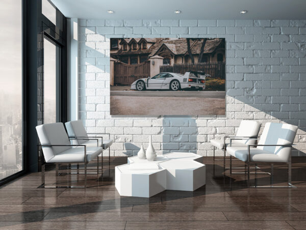 Minimalist living room interior with white brick wall and chairs errari F40 grey art print displayed on large canvas in modern minimalist living room with white brick wall, contemporary furniture and natural lighting
