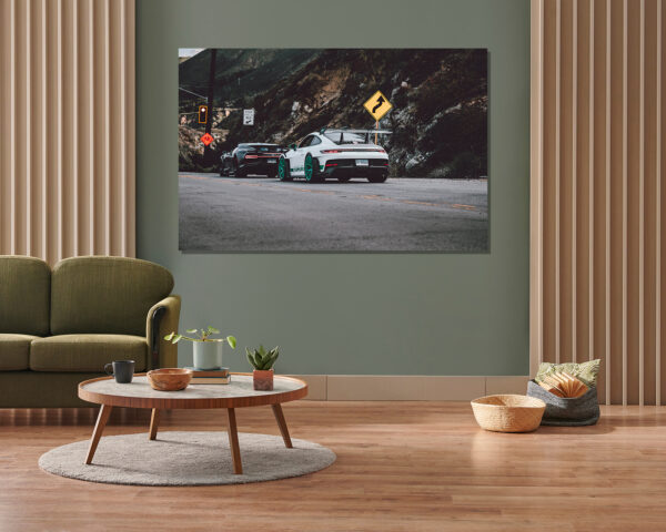 Wall decor photo of white Porsche GT3 RS with teal wheels and black Bugatti Chiron on canyon road, perfect for luxury automotive interior decoration