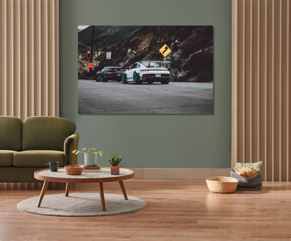 Green wall background, minimalist sofa, marble pattern wooden so Wall decor photo of white Porsche GT3 RS with teal wheels and black Bugatti Chiron on canyon road, perfect for luxury automotive interior decoration