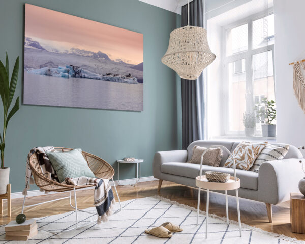 Wall decor photography of Jökulsárlón glacier in Iceland showing azure blue icebergs floating on the glacial lagoon under a pink twilight sky, perfect for Scandinavian interior design