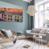 Framed photography of Sunset Saguaro Palm Springs displayed in a modern Scandinavian interior above a white sofa