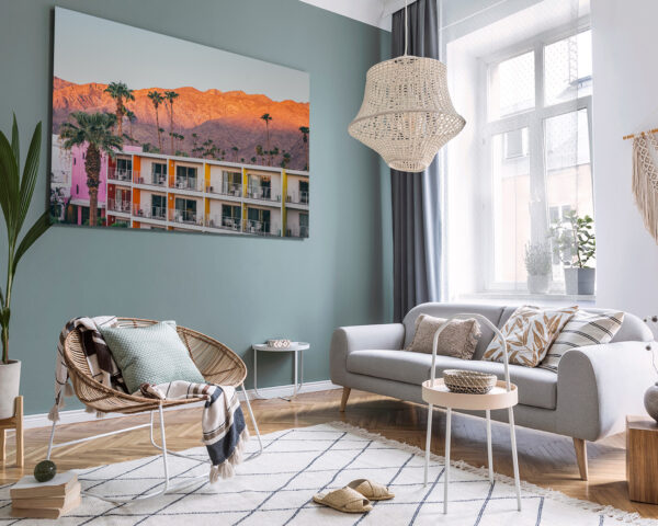 Framed photography of Sunset Saguaro Palm Springs displayed in a modern Scandinavian interior above a white sofa