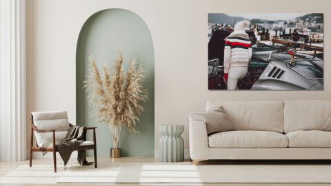 Ferrari 275 GTB photography showing a person in white winter attire with ski gear mounted on a classic silver Ferrari at the St. Moritz Concours d'Elegance 2023