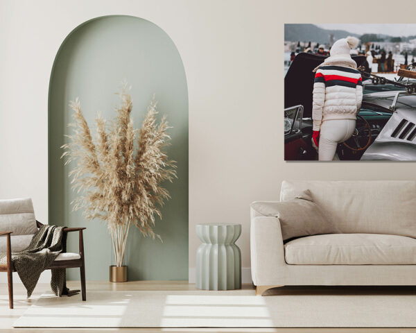 Ferrari 275 GTB photography showing a person in white winter attire with ski gear mounted on a classic silver Ferrari at the St. Moritz Concours d'Elegance 2023