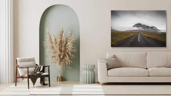 Photograph of Route 1 in Iceland – Majestic Landscape Dramatic landscape photograph of Iceland's Route 1 (Ring Road) winding through a vast, untouched wilderness with majestic mountains, moody skies, and the distinctive ribbon of highway cutting through rugged terrain