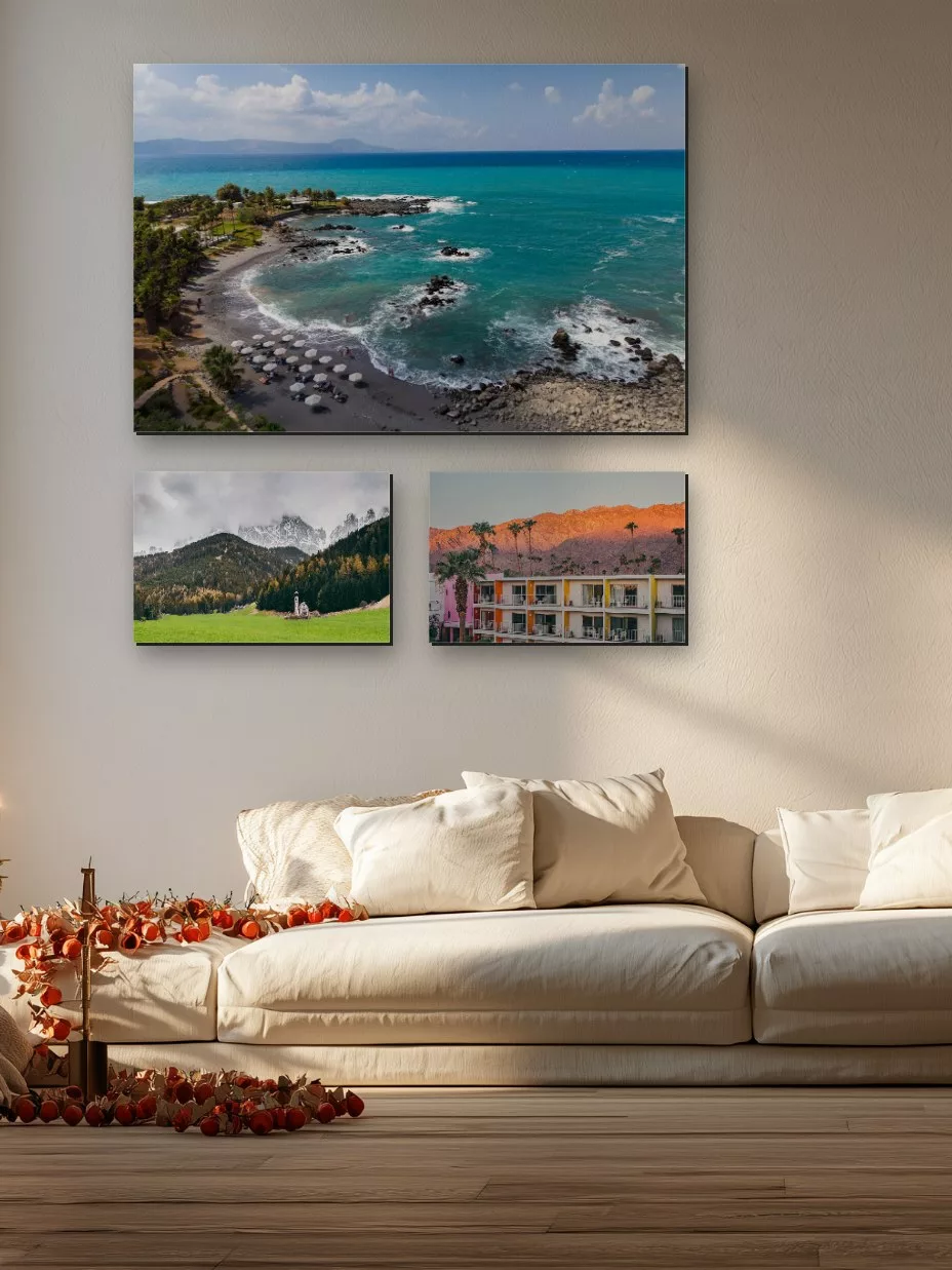 Three landscape fine art prints in a bright Christmas living room
