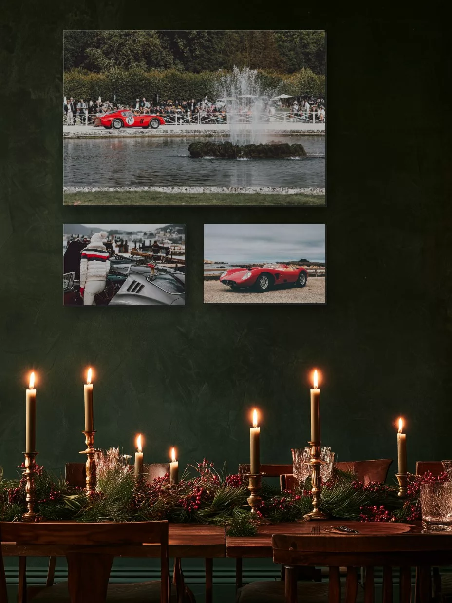 Three Ferrari fine art prints on a dark green wall