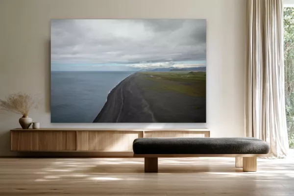 Iceland black sand beach wall art mockup Iceland black sand beach fine art print hanging above a pale oak sideboard in a calm Scandinavian living room