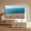 Zahara de los Atunes Spain wall art mockup Zahara de los Atunes beach in Spain fine art print hanging above a rattan sideboard in a bright Andalusian living room