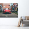 Grey sofa with pillows near white wall in stylish living room in Porsche GT4 photography and tags