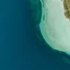 Fine art photograph — Lake Kournas, Crete Aerial photograph of Lake Kournas in Crete: deep blue water, turquoise shallows and a small boat