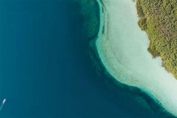 Fine art photograph — Lake Kournas, Crete Aerial photograph of Lake Kournas in Crete: deep blue water, turquoise shallows and a small boat