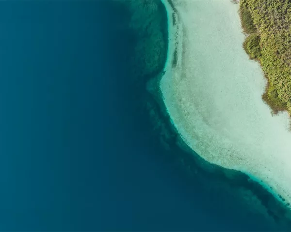 Fine art photograph — Lake Kournas, Crete Aerial photograph of Lake Kournas in Crete: deep blue water, turquoise shallows and a small boat