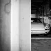 porsche-911-driver-pit-garage-black-and-white-photography Porsche 911 and its driver in the pit garage — black and white fine art photography limited edition print