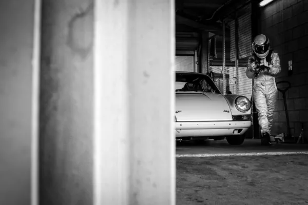 porsche-911-driver-pit-garage-black-and-white-photography Porsche 911 and its driver in the pit garage — black and white fine art photography limited edition print