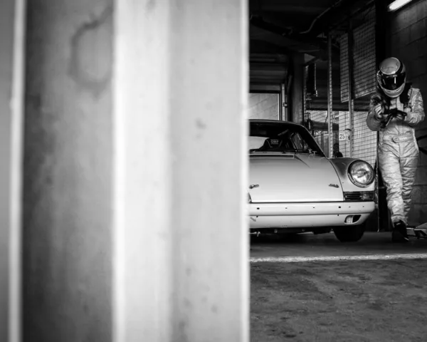 porsche-911-driver-pit-garage-black-and-white-photography Porsche 911 and its driver in the pit garage — black and white fine art photography limited edition print