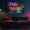 tableau-san-francisco-nuit-salon-mockup-v2.webp San Francisco at night wall art, Broadway neon lights, hung above a velvet sofa in a deep teal living room