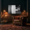 wall-art-porsche-911-driver-pit-garage-mockup Black and white Porsche 911 pit garage wall art in a loft lounge with a leather armchair