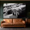 wall-art-vintage-race-cars-paddock-number-33-mockup Black and white vintage race car wall art above a tan leather sofa in a green library