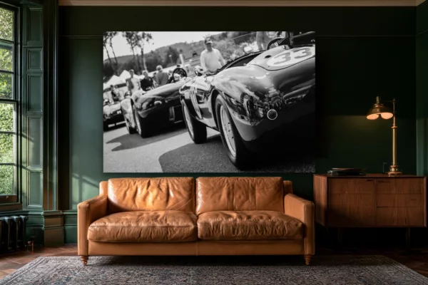 wall-art-vintage-race-cars-paddock-number-33-mockup Black and white vintage race car wall art above a tan leather sofa in a green library